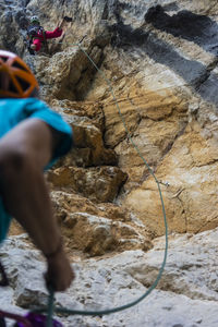 Low section of person standing on rock