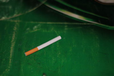 Close-up of cigarette on table