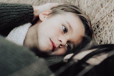 Portrait of young woman lying down