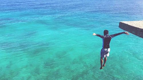 High angle view of man diving into sea