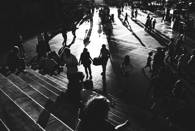 High angle view of people walking in city