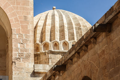 Low angle view of historic building.
artuklu, mardin, turkey, historical kasimiye madrasa, mardin