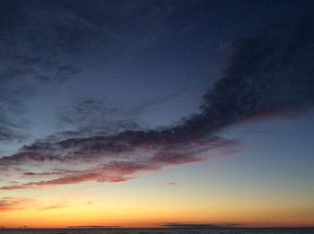 Low angle view of sky over sea during sunset