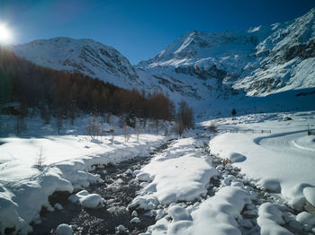 Snow covered mountains against sky