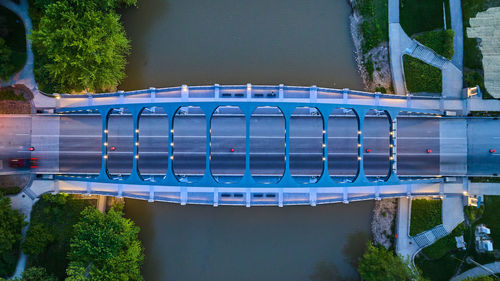 Low section of woman standing on bridge