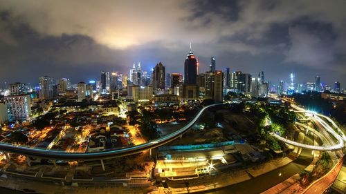 Illuminated buildings in city at night