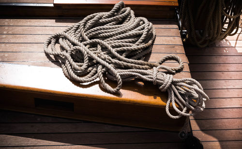 High angle view of rope tied on metal