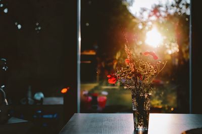 Close-up of illuminated flower vase on table