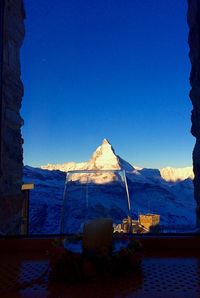 View of landscape against clear blue sky