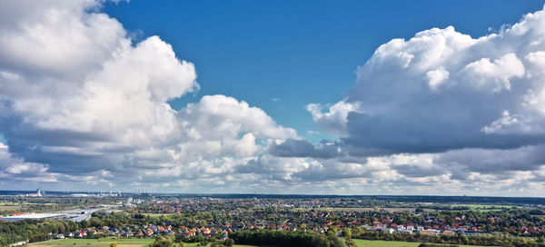 Cloudy dramatic sky over a suburb of wolfsburg, germany, aerial view