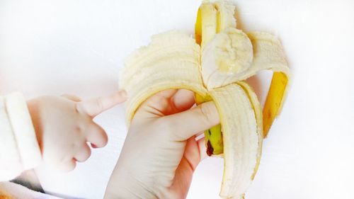 Close-up of woman holding fruit