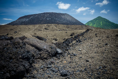 Scenic view of volcanic landscape against sky