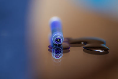 Close-up of electric lamp on table