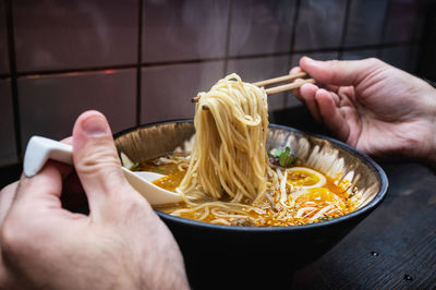 Midsection of man preparing food