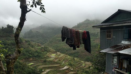 Clothes drying on clothesline against sky