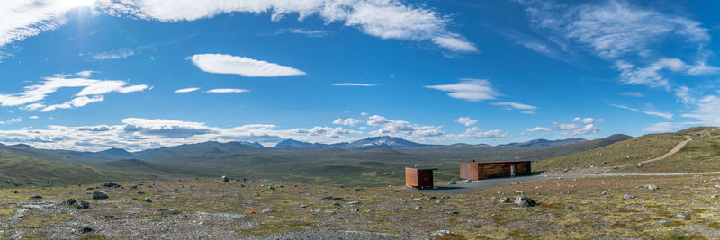 Scenic view of landscape and mountains against sky