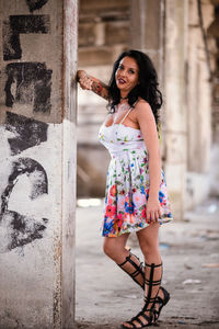 Portrait of smiling young woman standing outdoors