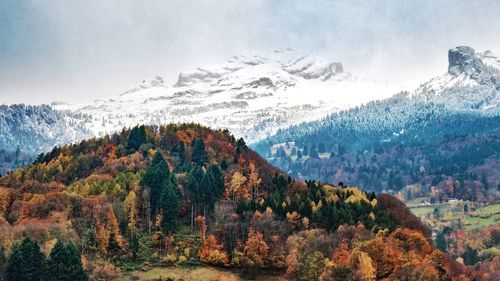 Scenic view of mountains against sky during winter