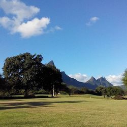 Scenic view of mountains against cloudy sky