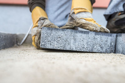 Low section of man working on concrete