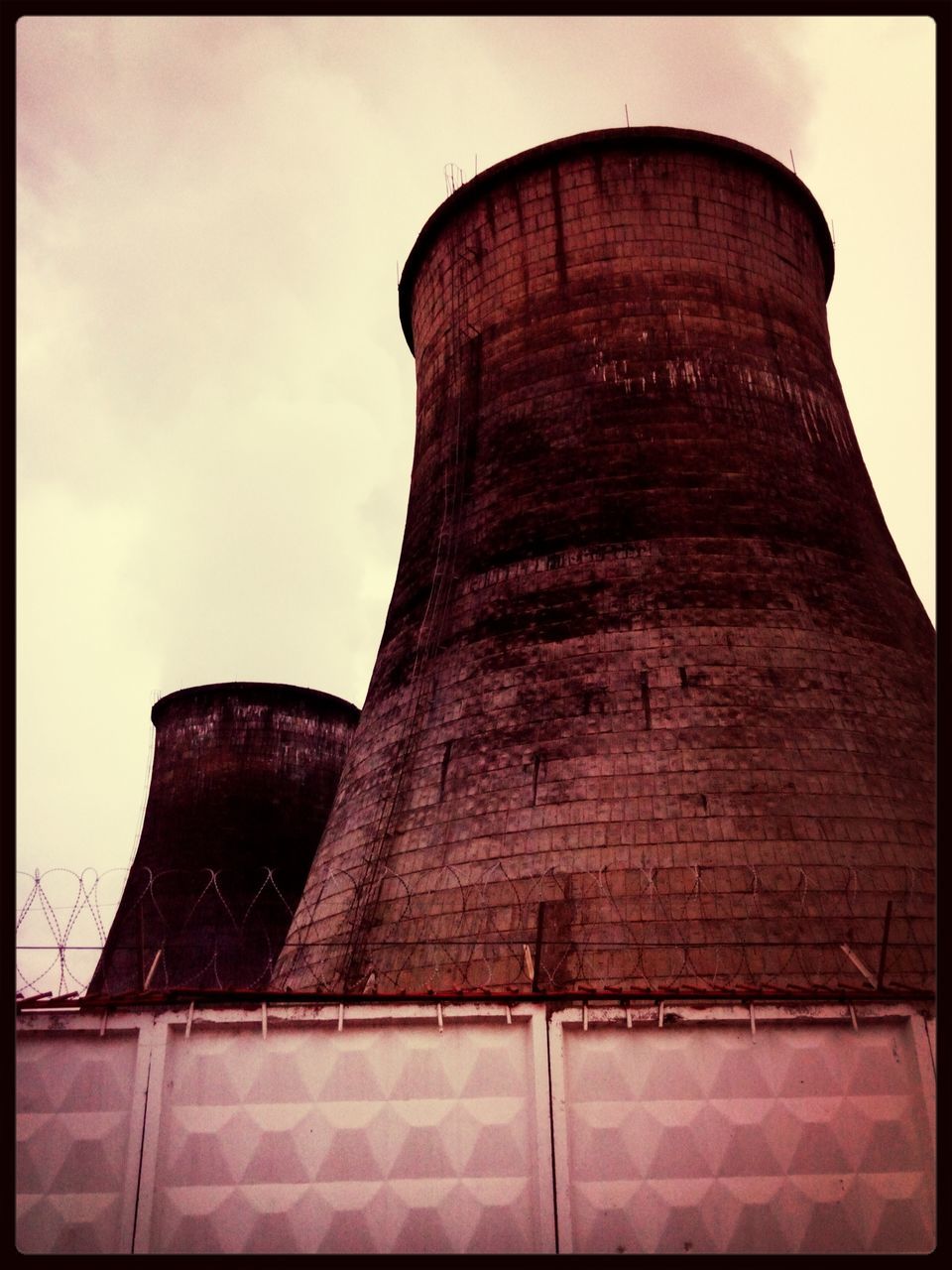 transfer print, architecture, built structure, low angle view, auto post production filter, building exterior, sky, history, tower, old, brick wall, outdoors, day, no people, clear sky, wall - building feature, travel destinations, famous place, cloud, stone wall