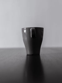 Close-up of empty coffee cup on table