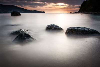 Scenic view of sea against dramatic sky