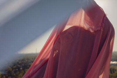 Close-up of red flags against the sky