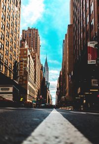 Surface level of narrow street along buildings