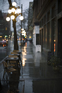 Wet illuminated street at night