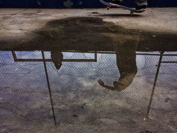 Reflection of road in puddle