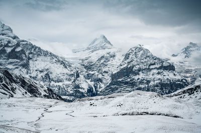 Snow covered mountains against sky