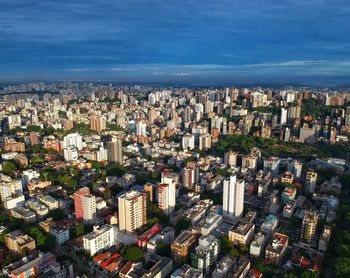 High angle view of modern buildings in city against sky