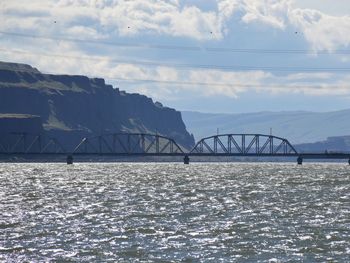 Bridge over sea against sky