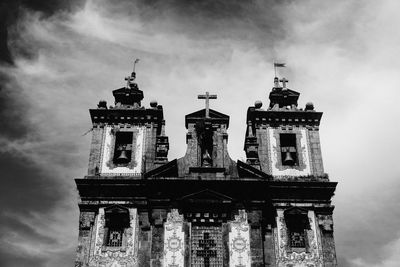 Low angle view of temple against cloudy sky