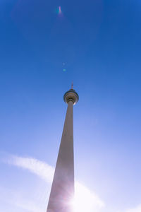 Low angle view of fernsehturm against blue sky