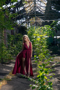 Portrait of young woman standing in abandoned shunting yard