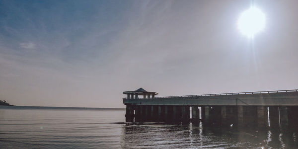 Pier over sea against sky