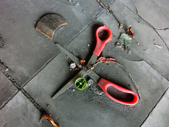 High angle view of abandoned scissors on floor