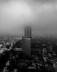 High angle view of buildings in city against sky