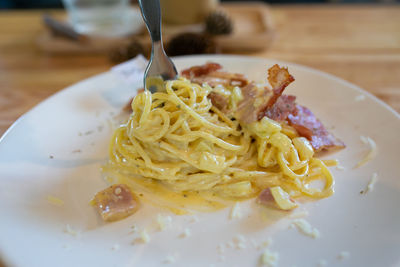 Close-up of noodles in plate on table