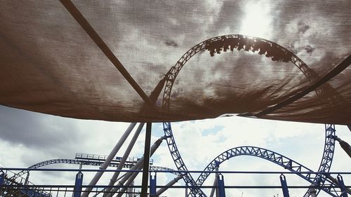 Low angle view of rollercoaster against sky