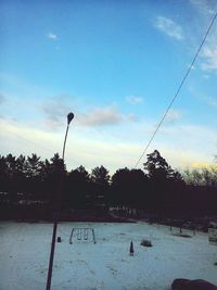 People enjoying in park against sky