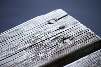 Close-up of wooden plank on table