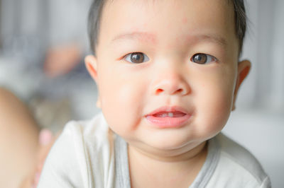 Close-up portrait of cute baby at home