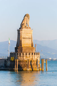 Statue of historic building against sky