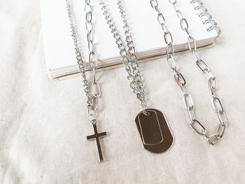 High angle view of chain on table against wall