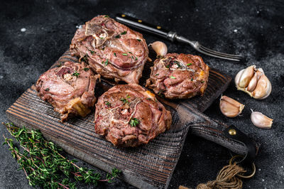 High angle view of meat on barbecue grill