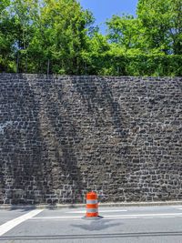 Road sign against wall