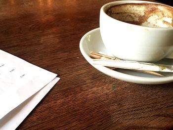 High angle view of coffee cup on table